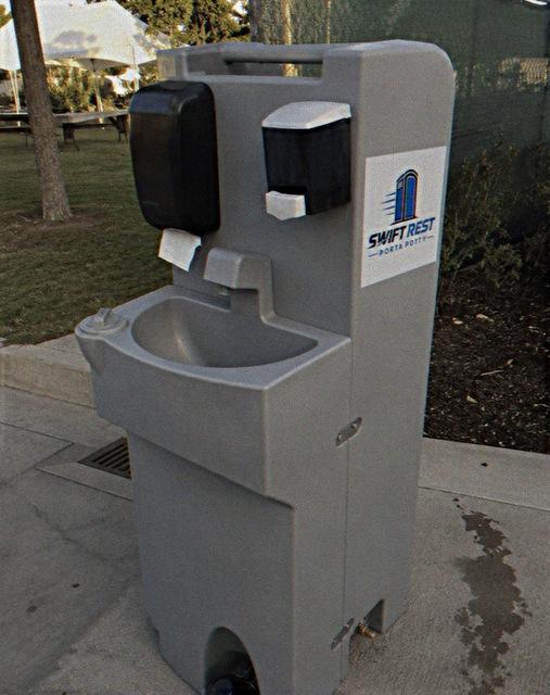 Portable handwash station rental with soap and towel dispensers